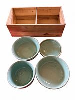 Set overview showing four ceramic dishes and wooden box