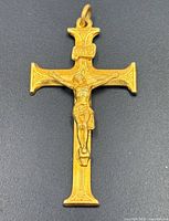 Front view showing crucifix design with INRI plaque and raised corpus