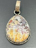 Front view showing agate cabochon and bezel setting