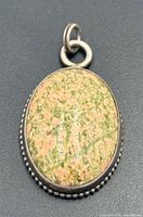 Front view of oval Unakite pendant