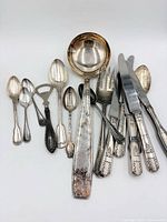 Full lot view showing all assorted silver plated pieces