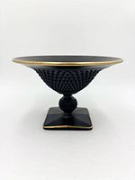 Side profile showing bowl shape, diamond texture, square foot, gold trim