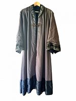 Front view showing embroidery on collar and cuffs, full length