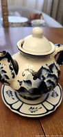 Mini blue & white floral teapot on matching saucer