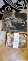 Front covers of both hardcover books showing dust jackets: 'Castles of Europe' on top, 'Rabelais' beneath