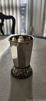 Full view of cup showing gilt interior and Jerusalem motif base