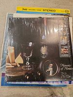 Stack of LPs, top record 'Memories of Morocco' shrink-wrapped