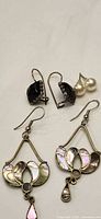 Front view showing all three earring pairs, highlighting materials and styles