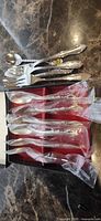 Overview of all flatware pieces, both boxed and loose