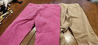 Rear view of both pairs showing colors and pocket style