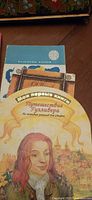 Front covers of the board book and partial view of Valentin Kataev book