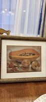 Front view of framed still life print