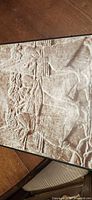 Assyrian relief artwork on box cover