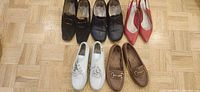Top view showing all five pairs in two rows on wooden floor