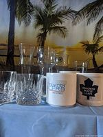 Group shot showing mugs, beer glasses and crystal tumblers