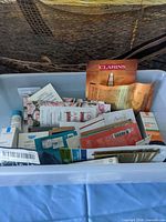 Overview of bin containing assorted skincare samples