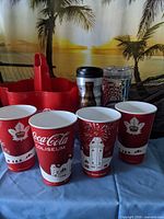 Group shot showing carrier, tumblers and four paper cups