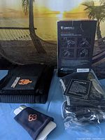 Boxed Comforce shoulder brace, folded Spartans back brace, bagged accessories, Copper Cu Compression wrist sleeve