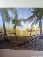 Full view of large beach sunset poster on wall
