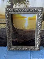 front view of ornate silver picture frame
