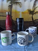 Group shot of all five drinkware items standing upright