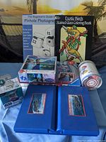 Group shot showing puzzles, Grogu figure, travel peg board game, coloring book, photography book