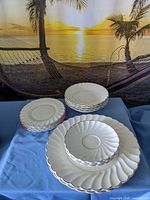 Three stacks of Myott Chelsea white porcelain dinner, salad, charger plates and bowls