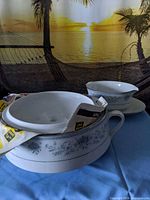 Covered tureen with lid and gravy boat frontal view