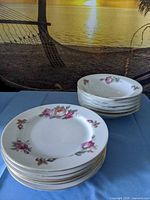 Stacks of floral dessert plates and bowls