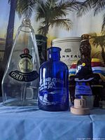 Group shot showing all bottles, stopper and box