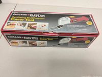 Front view of boxed Chicago Electric oscillating tool