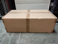 Closed brown shipping carton taped shut