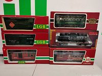All six boxed G scale cars stacked for overview