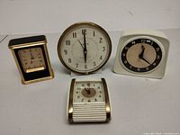 Front view showing all four alarm clocks together