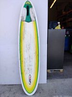 Full deck view showing color fade, traction pad, carry handle