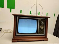 Front view showing screen, control panel, antenna