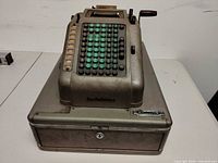 Front view showing keyboard, logo, cash drawer