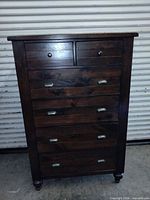 Front view showing all six drawers and hardware