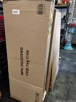 Full view of sealed Yafylly dog crate carton