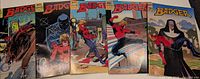Five Badger comic book issues side by side
