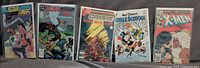Group shot of five bagged comic issues