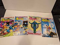 All four comic issues laid out for full view