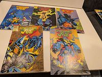 All five Dynamo Joe issues laid out