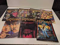 All seven Eflord comic books laid out showing front covers