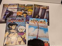 Five Elflord comics laid out