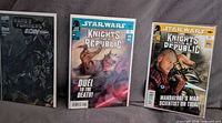 Front covers of all three bagged comic books displayed upright