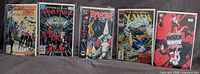 All five bagged comics front covers