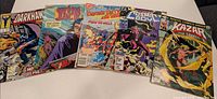 All five comic books laid out for identification