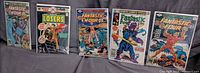 Group shot of all five bagged comic books
