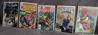 All five comics side-by-side, bagged